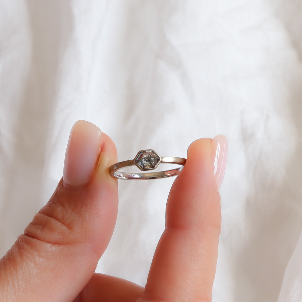 Bezel Setting salt & Pepper hexagonal diamond ring in champagne white gold with matte finish.