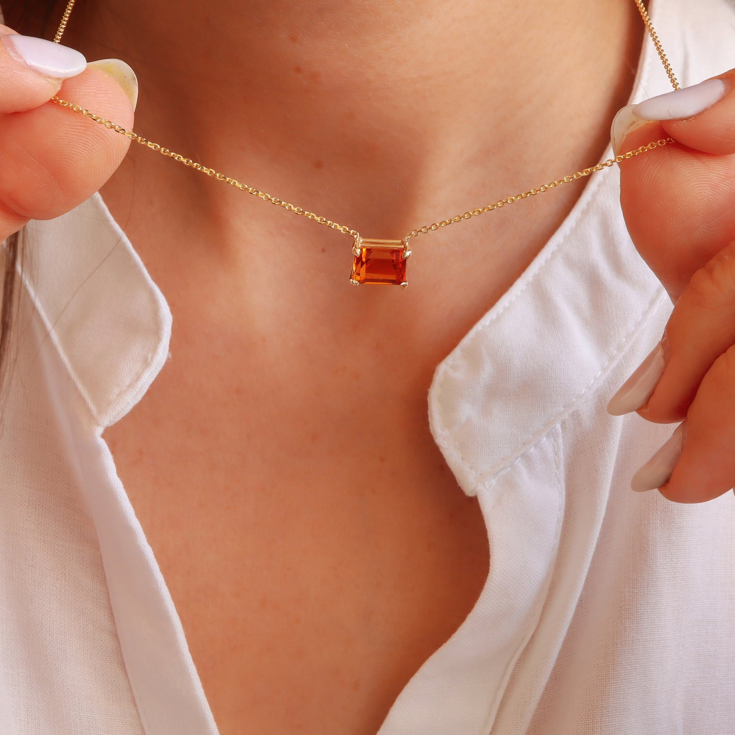 Dazzling citrine gemstone pendant necklace enhances a woman's beauty.