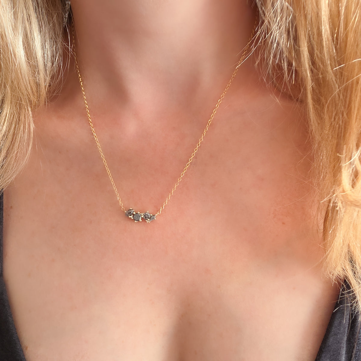 Galaxy Salt & Pepper Diamond cluster necklace in 14K yellow gold worn at the collarbone – Dina Jewelry