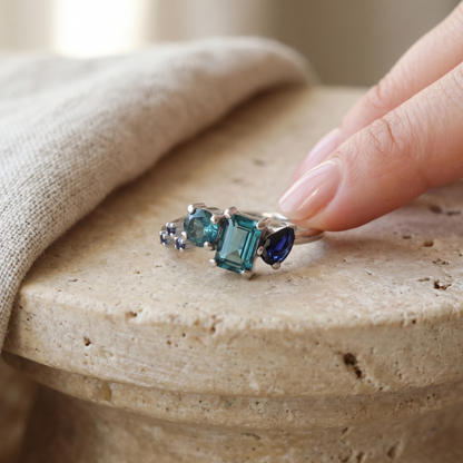 blue Sapphire and topaz asymmetrical ring in white gold.