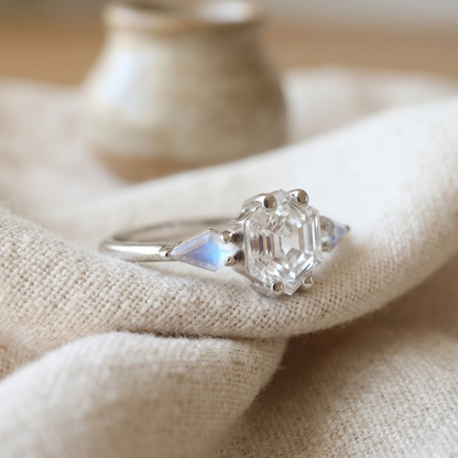 Side View of a three stone ring with diamond and moonstones in white gold.