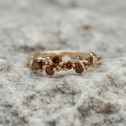 14K brown diamond cluster ring accented with white clear diamonds.