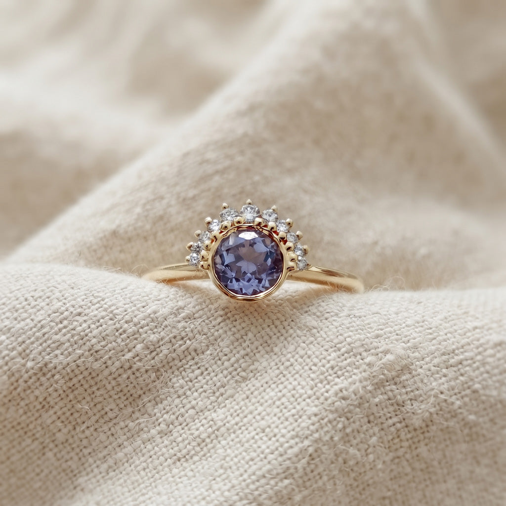 14k gold ring featuring a purple sapphire and diamond in a half halo setting design.