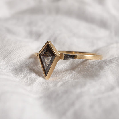Three-Stone diamond ring features slat and pepper diamonds - Kite & Tapered baguettes in yellow gold with matte finish.