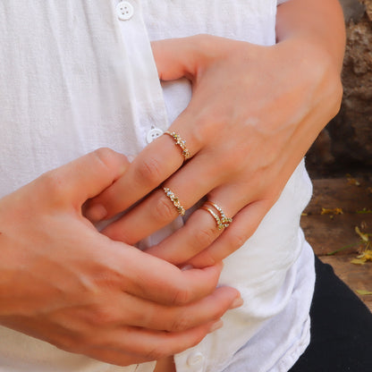 The cluster collection by Dina Jewelry, featuring gold ring and unique colored diamonds.