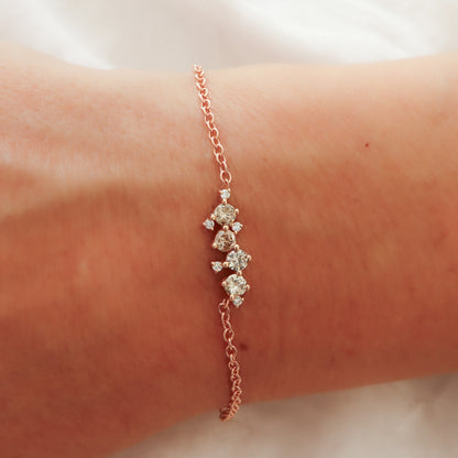 A close-up view of the rose gold bracelet on the wrist, highlighting the unique shade of the brownish-grey diamonds.