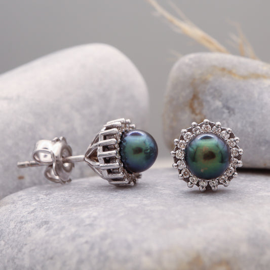 Tahitian black pearl in halo style studs surrounded with natural diamond in white gold earrings.