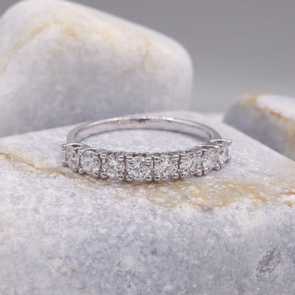 Elegant Delicate Diamond Half Eternity Ring in white gold showcased on a refined grey stone.