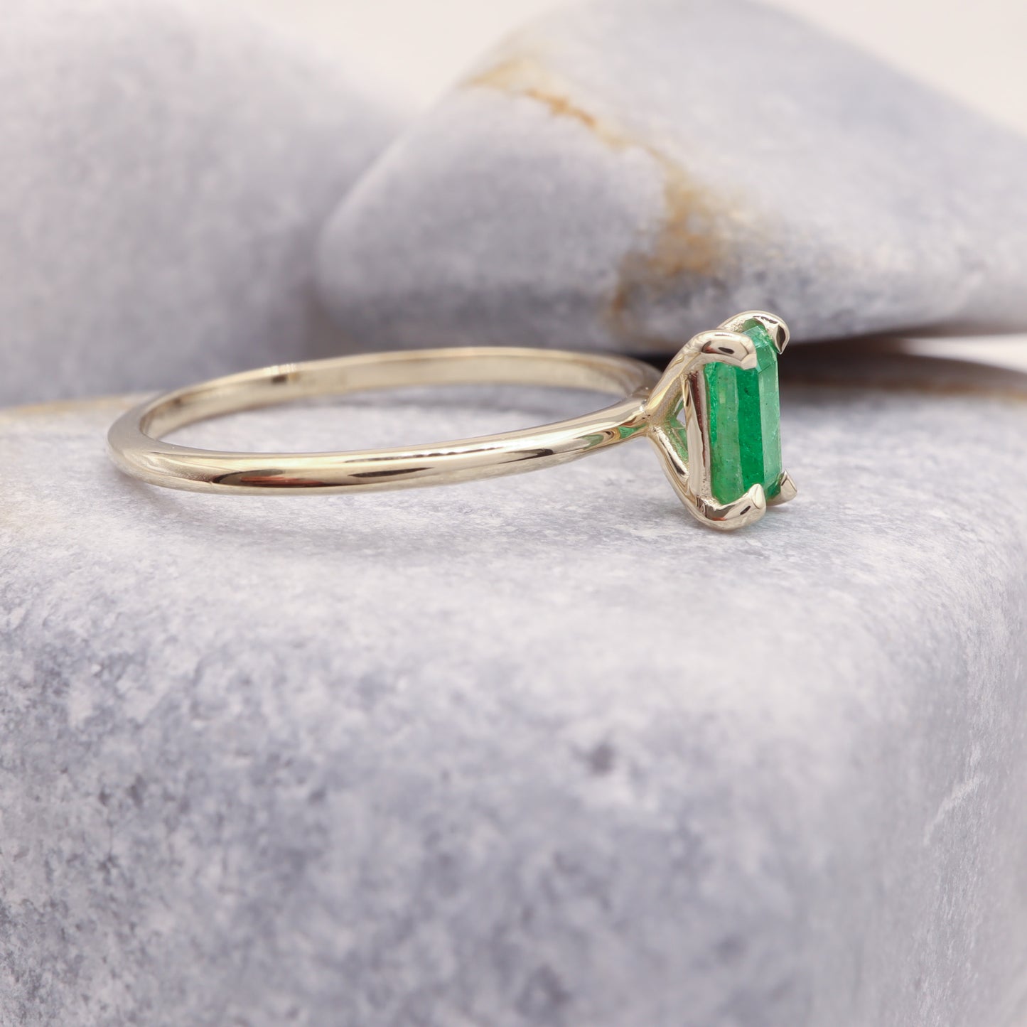 profile vie of our green emerald solitaire ring.