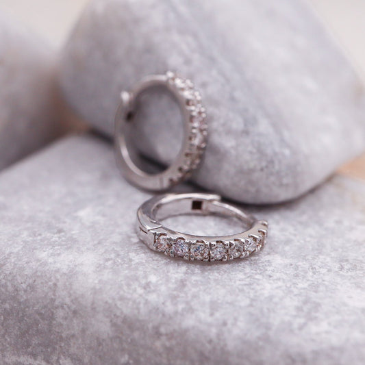 White Gold Huggie Hoop Earrings featuring Natural Diamonds.