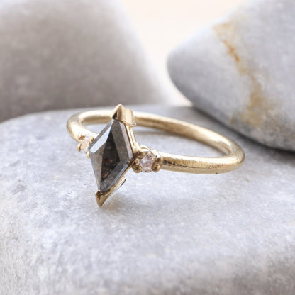 Kite Shape Diamond in a Grey Salt and Pepper Diamond Followed by a diamond on each side in a gold rustic finish.