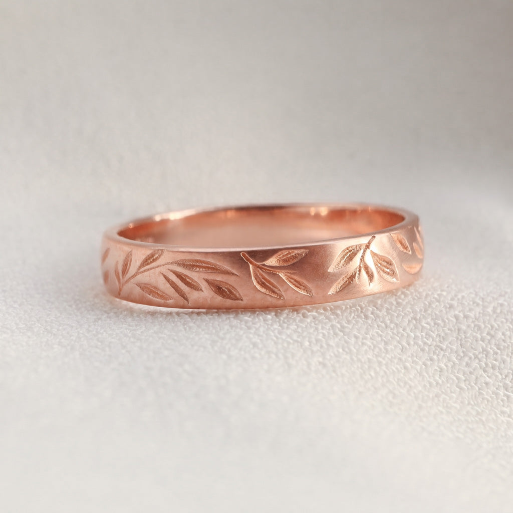 Scattered leaves wedding band in rose gold 14k.