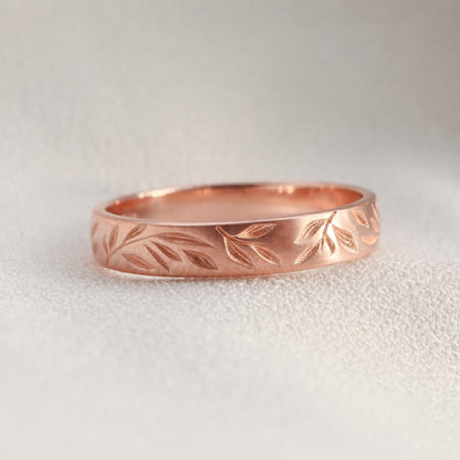 Scattered leaves wedding band in rose gold 14k.