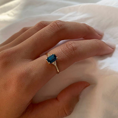 Captivating Blue Sapphire Ring on a woman's hand, a symbol of timeless love and commitment.