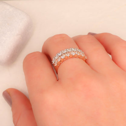  harmonious blend of rose and white gold Delicate Diamond Half Eternity Rings gracing a woman's finger.