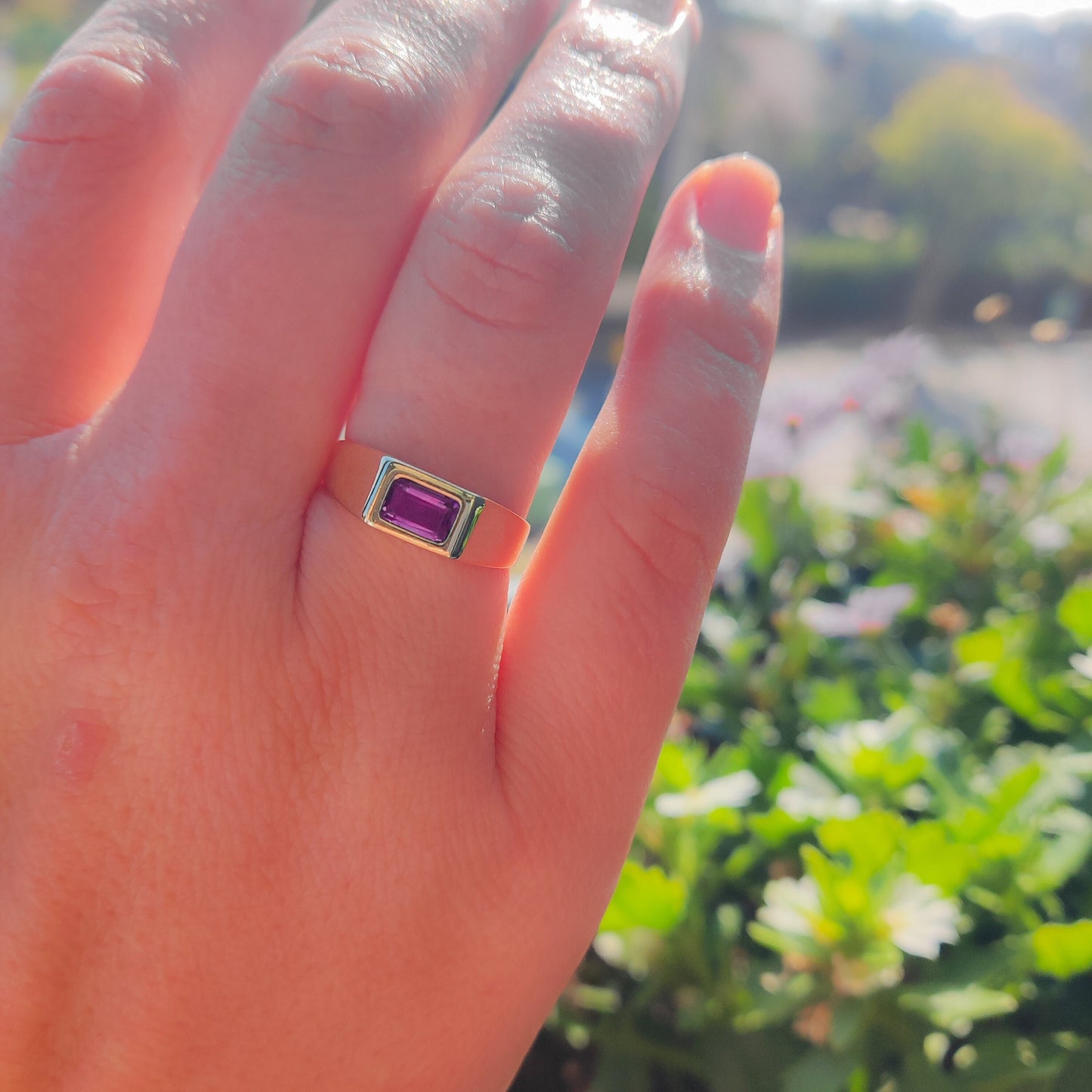 Natural Amethyst Square Signet Ring in Solid Gold elegantly worn on a woman's hand