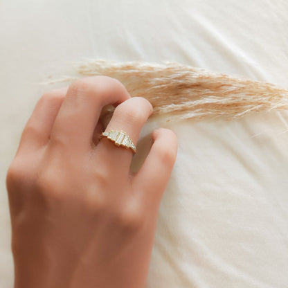 Diamond Baguette Gold Ring with Bezel-Set Vertical Step Design elegantly adorning a woman's hand